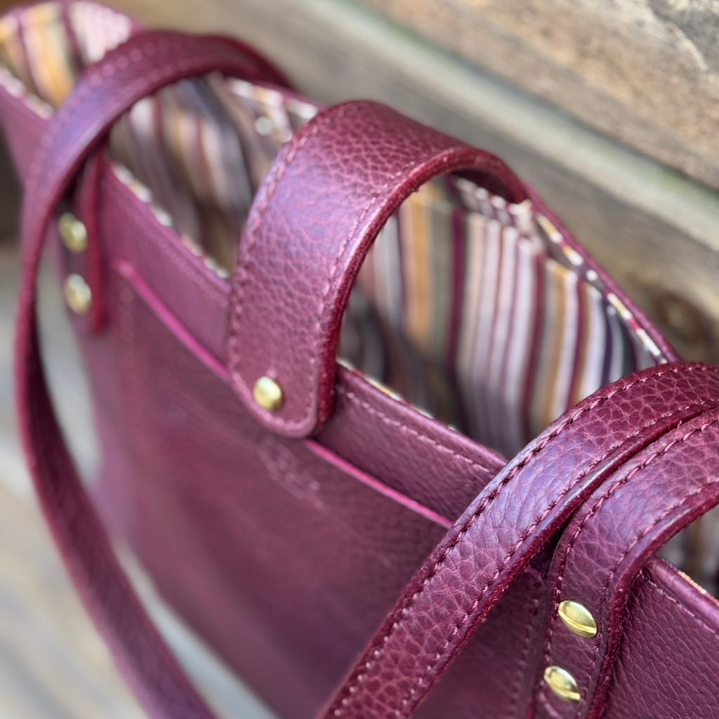 The Limited Edition Megan close up in plum color matching stripe liner